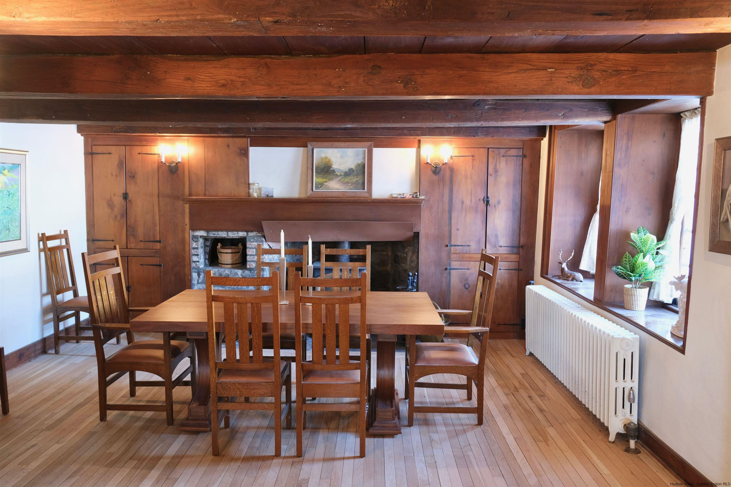 115 Buck Road Stone Ridge, NY 12484 - Photo 16 of 35 a view of a dining room with furniture and wooden floor