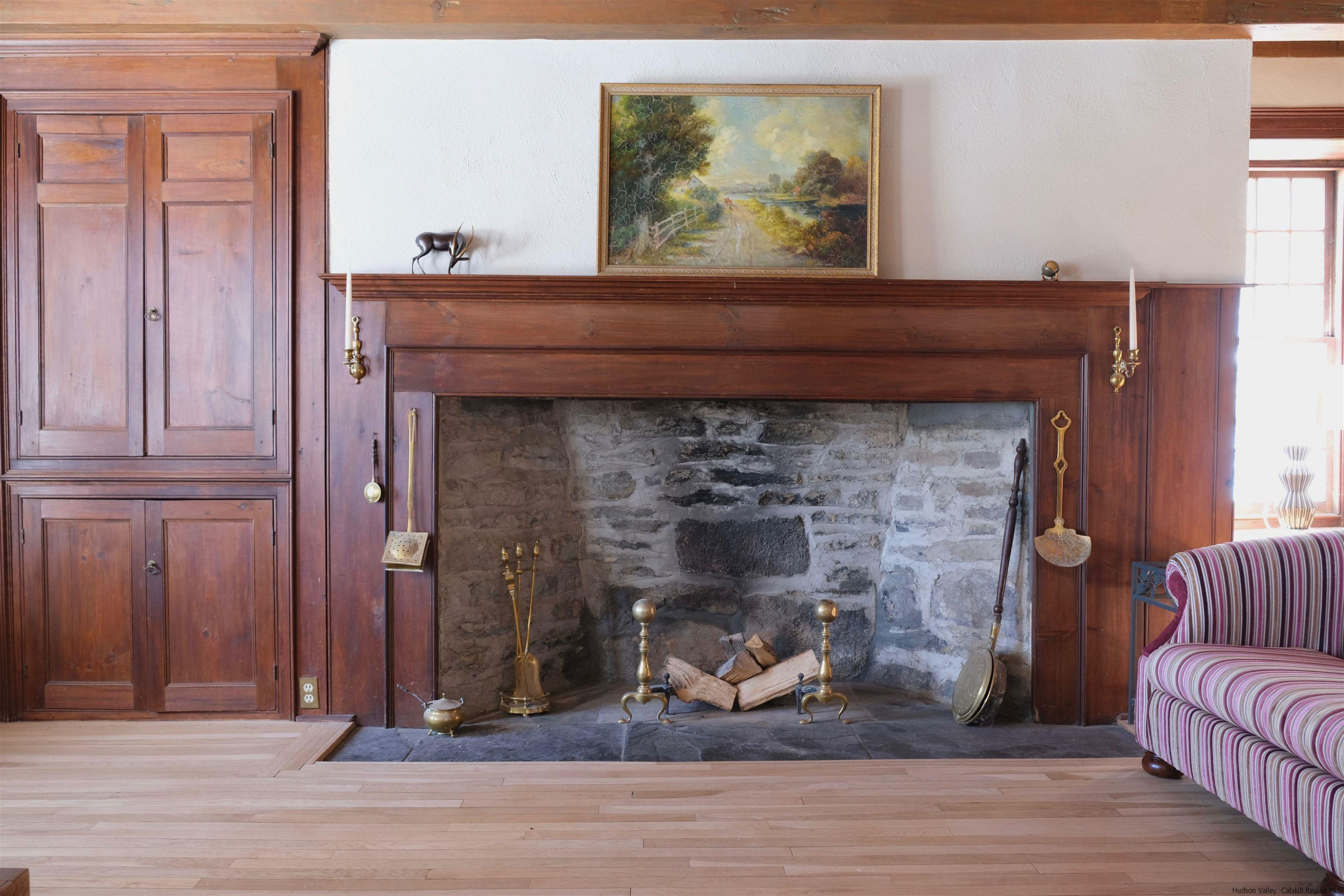 115 Buck Road Stone Ridge, NY 12484 - Photo 17 of 35 a living room with furniture and a fireplace