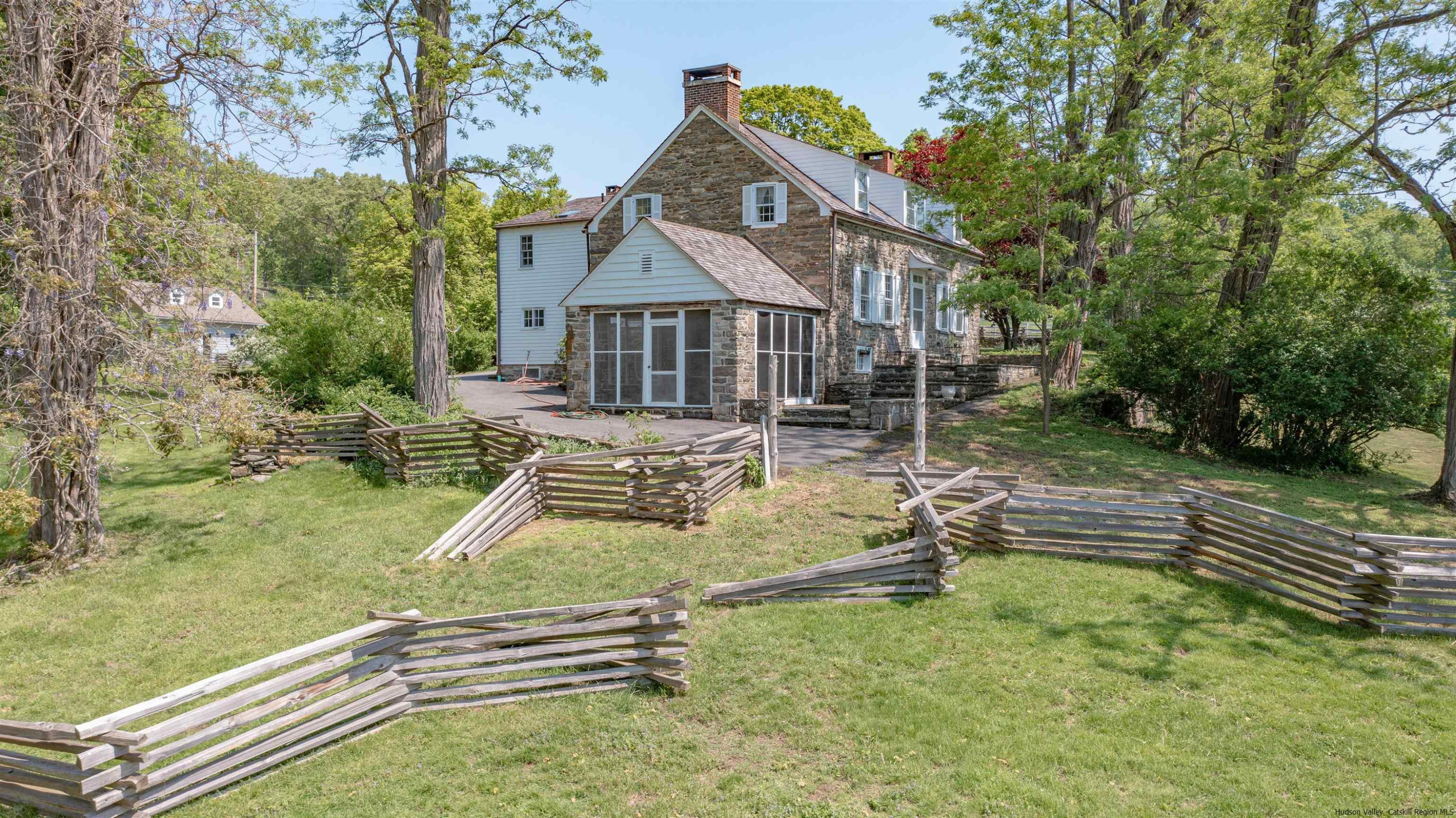 115 Buck Road Stone Ridge, NY 12484 - Photo 2 of 35 a house view with a garden space