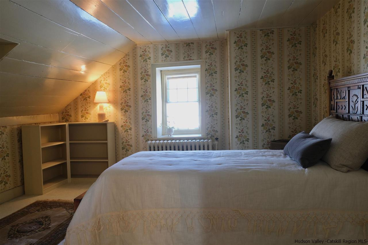 115 Buck Road Stone Ridge, NY 12484 - Photo 24 of 35 a bedroom with a bed and a window