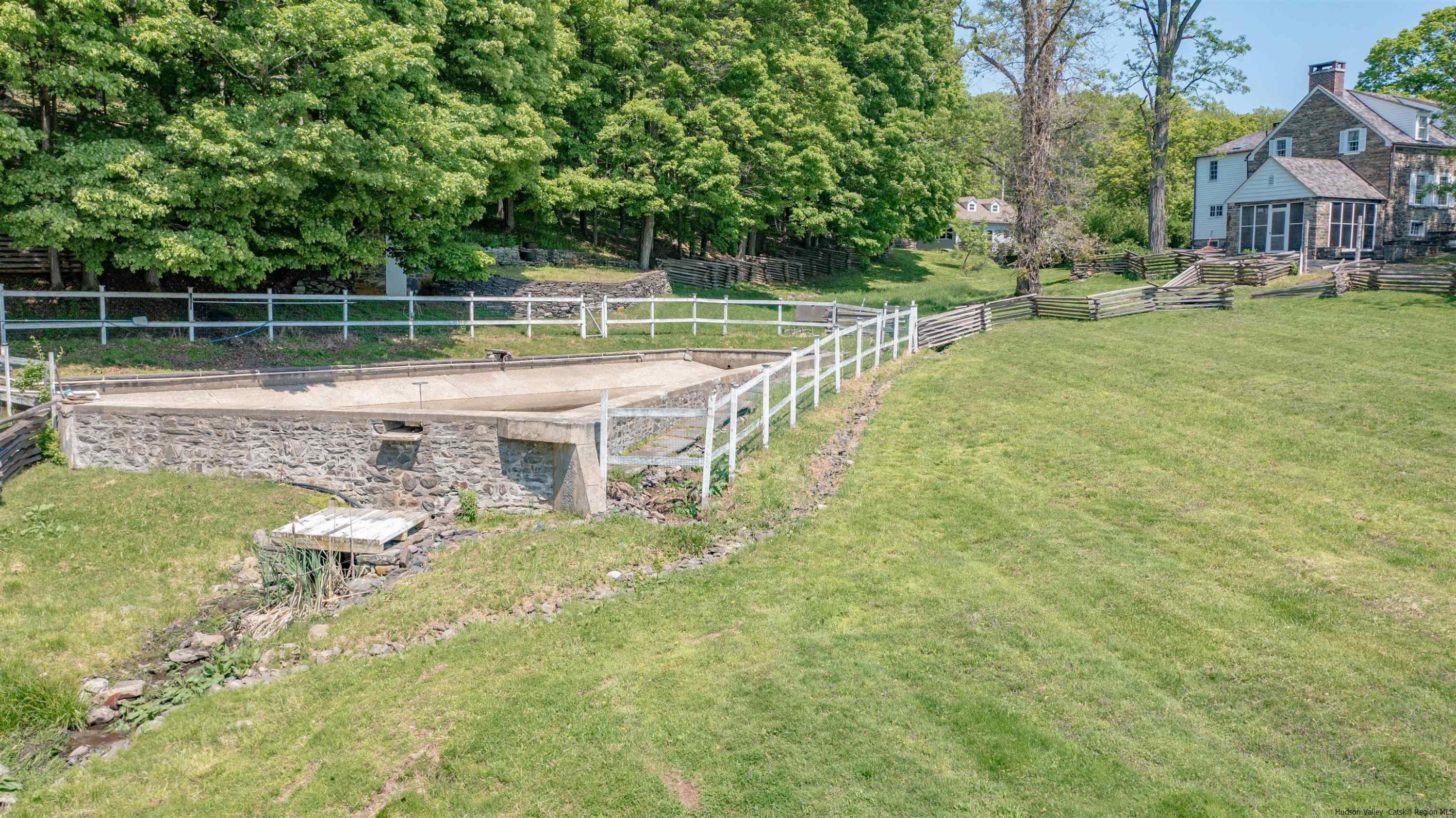 115 Buck Road Stone Ridge, NY 12484 - Photo 31 of 35 a view of a house with a yard