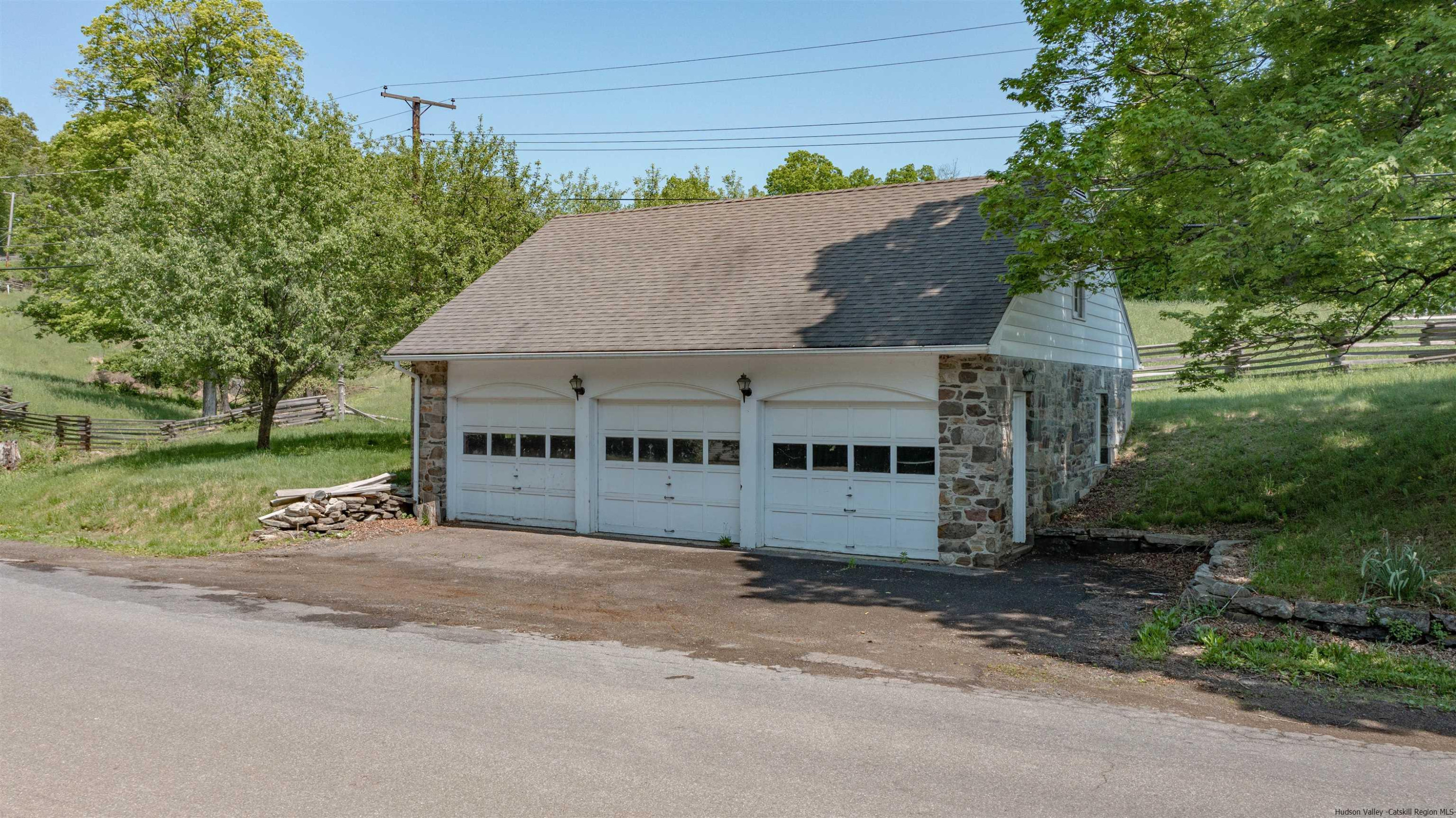 115 Buck Road Stone Ridge, NY 12484 - Photo 35 of 35 front view of a house with a garden