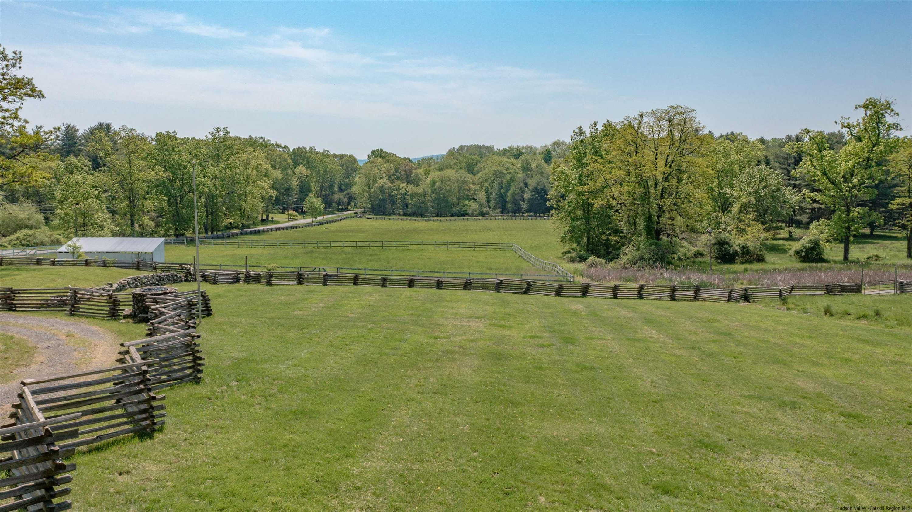 115 Buck Road Stone Ridge, NY 12484 - Photo 5 of 35 a view of a lake with houses in the back