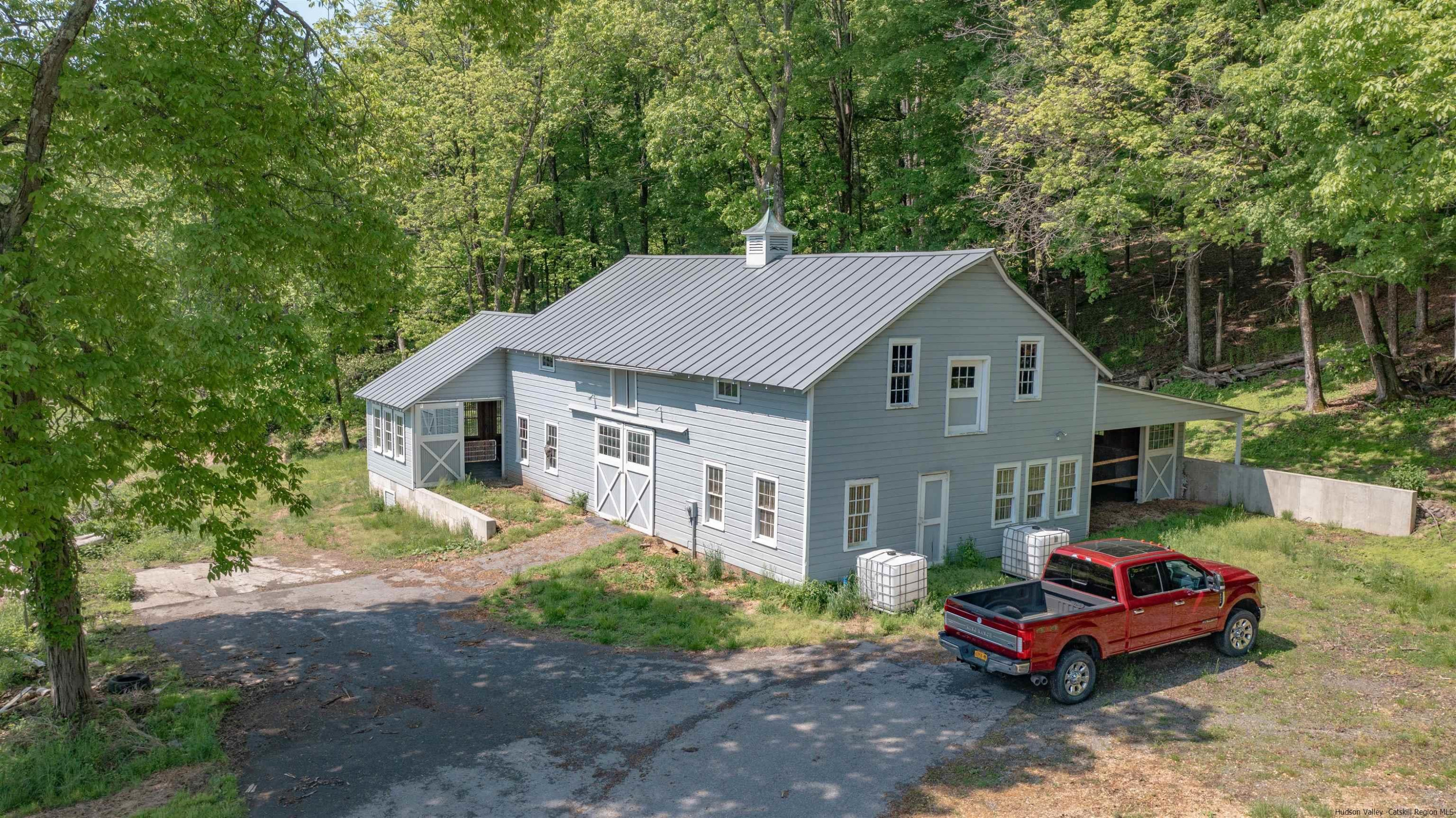 115 Buck Road Stone Ridge, NY 12484 - Photo 6 of 35 a front view of a house with garden