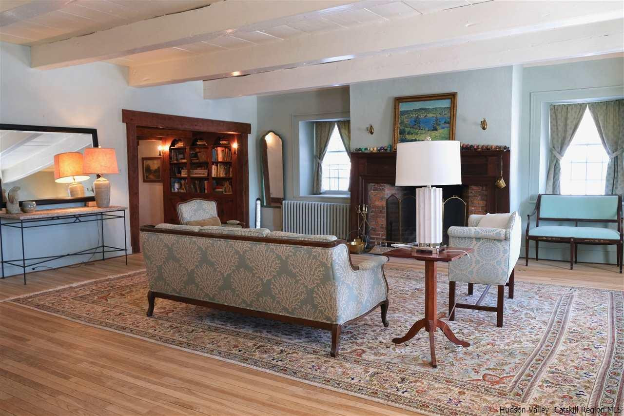 115 Buck Road Stone Ridge, NY 12484 - Photo 8 of 35 a living room with furniture and wooden floor