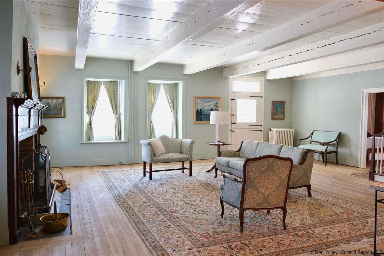 115 Buck Road Stone Ridge, NY 12484 - Photo 9 of 35 a living room with furniture and a wooden floor