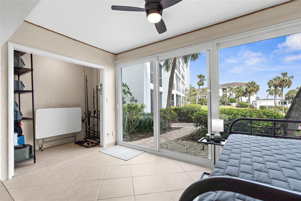 600 Sutton Place, Unit 101B Longboat Key, FL 34228 - Photo 20 of 53 a very nice looking room with a large window