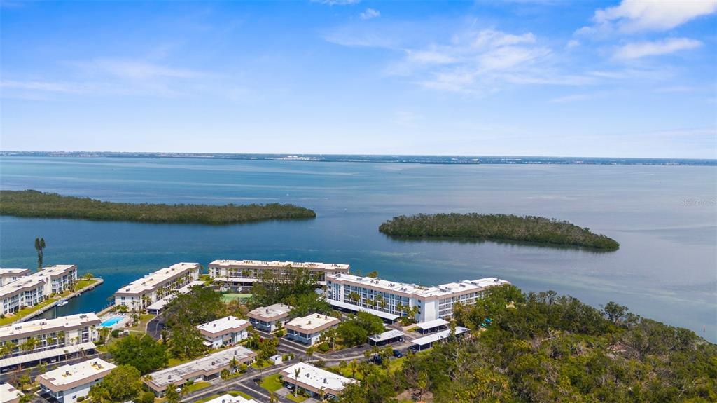600 Sutton Place, Unit 101B Longboat Key, FL 34228 - Photo 2 of 53 a view of a lake
