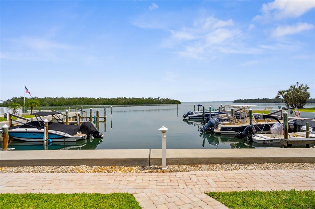 600 Sutton Place, Unit 101B Longboat Key, FL 34228 - Photo 28 of 53 a view of a lake