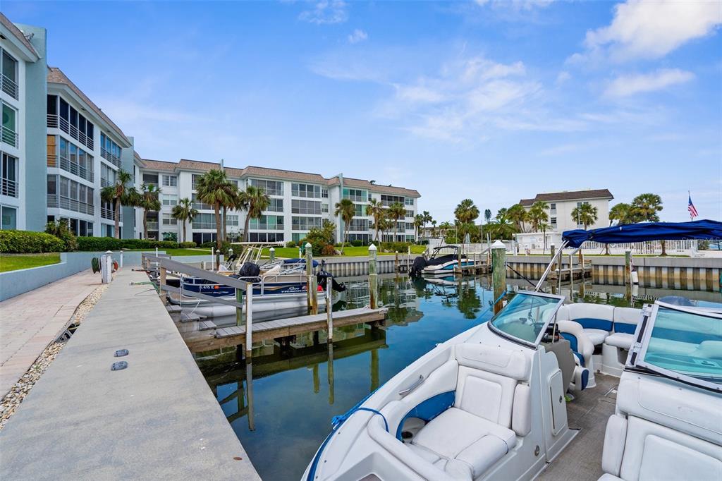 600 Sutton Place, Unit 101B Longboat Key, FL 34228 - Photo 29 of 53 a view of a chairs and table in the terrace