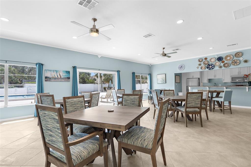 600 Sutton Place, Unit 101B Longboat Key, FL 34228 - Photo 36 of 53 a view of a dining room with furniture