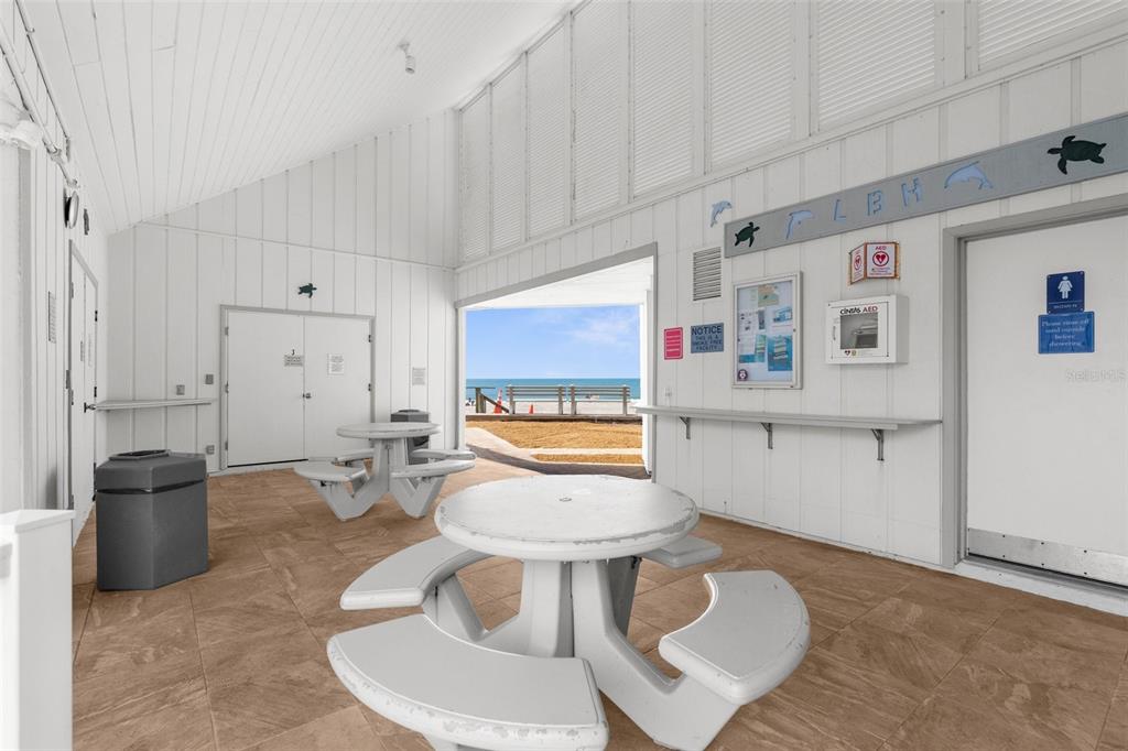 600 Sutton Place, Unit 101B Longboat Key, FL 34228 - Photo 41 of 53 a bathroom with a toilet sink and mirror