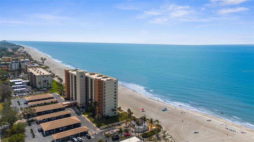 600 Sutton Place, Unit 101B Longboat Key, FL 34228 - Photo 44 of 53 a view of a yard with an ocean view