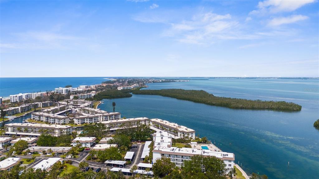 600 Sutton Place, Unit 101B Longboat Key, FL 34228 - Photo 47 of 53 a view of a lake with a city