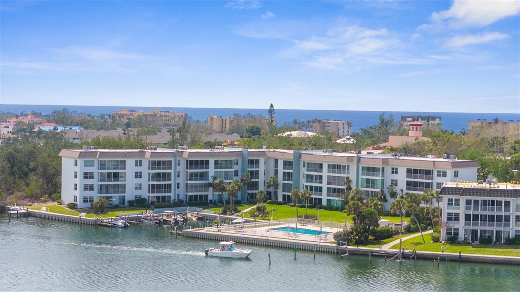 600 Sutton Place, Unit 101B Longboat Key, FL 34228 - Photo 49 of 53 a view of a city with tall buildings