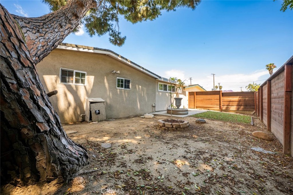 1238 North Studebaker Road Long Beach, CA 90815 - Photo 38 of 47 a view of a house with a backyard