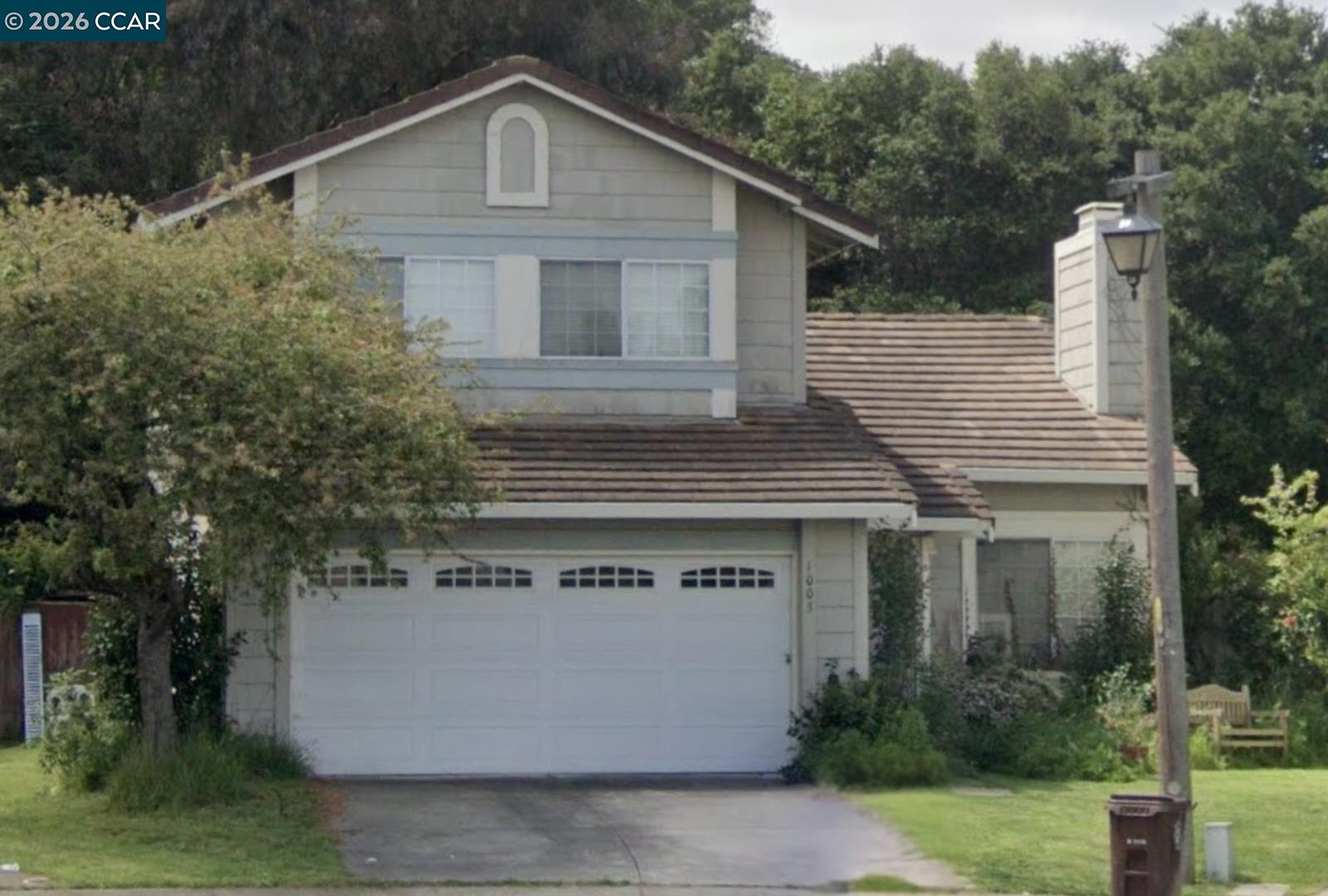 1003 Ignacio Court Pinole, CA 94564 - Photo 1 of 1 a front view of a house with a garden