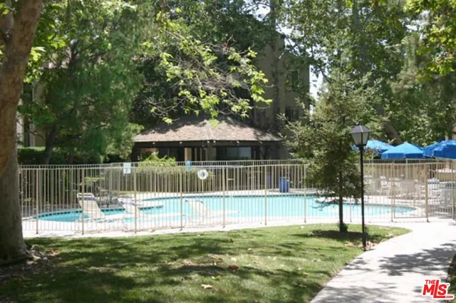 a house view with a sitting space and a garden