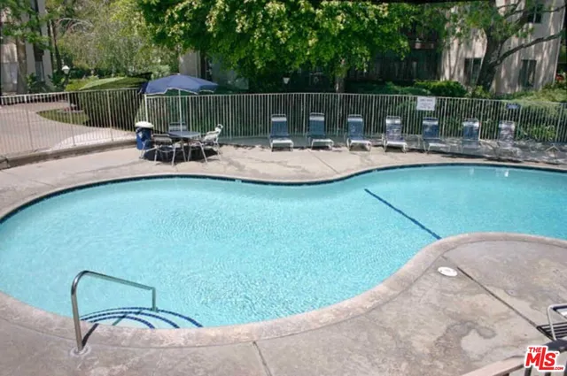 a view of a chair and table in the patio