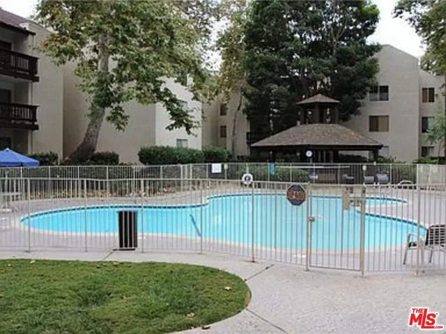a view of a deck with a small yard