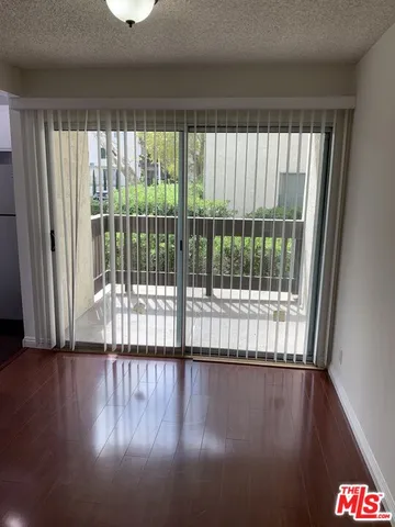 a view of wooden floor and brick walls