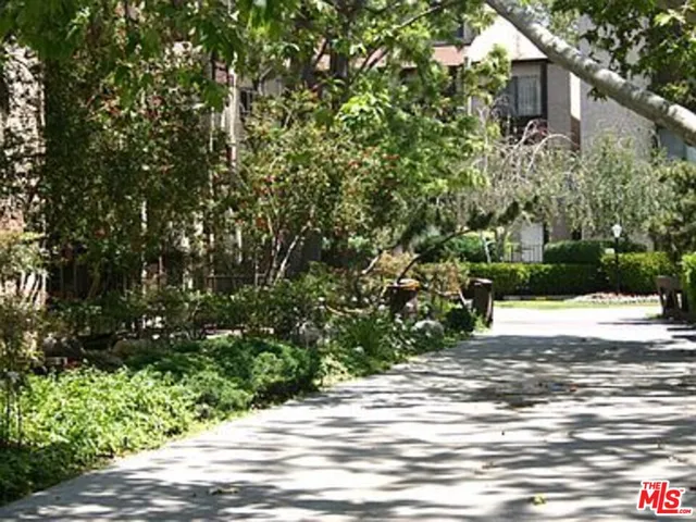 a view of a house with a tree
