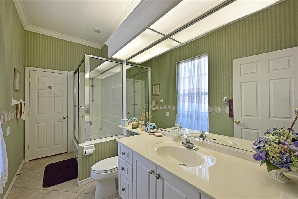 6602 Tallmast Circle Lakewood Ranch, FL 34202 - Photo 19 of 43 a bathroom with a sink a toilet and shower