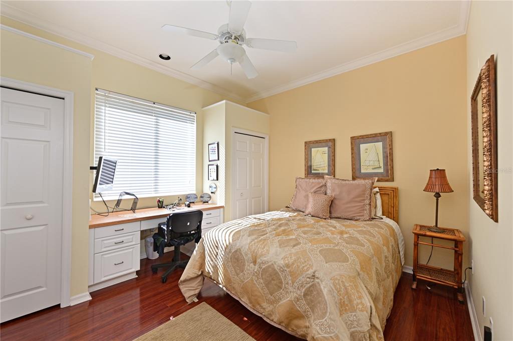 6602 Tallmast Circle Lakewood Ranch, FL 34202 - Photo 21 of 43 a bedroom with a large bed and a table