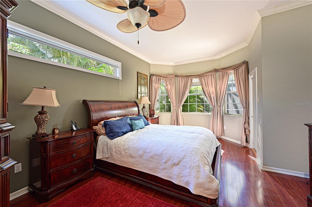 6602 Tallmast Circle Lakewood Ranch, FL 34202 - Photo 27 of 43 a bedroom with a bed and a window