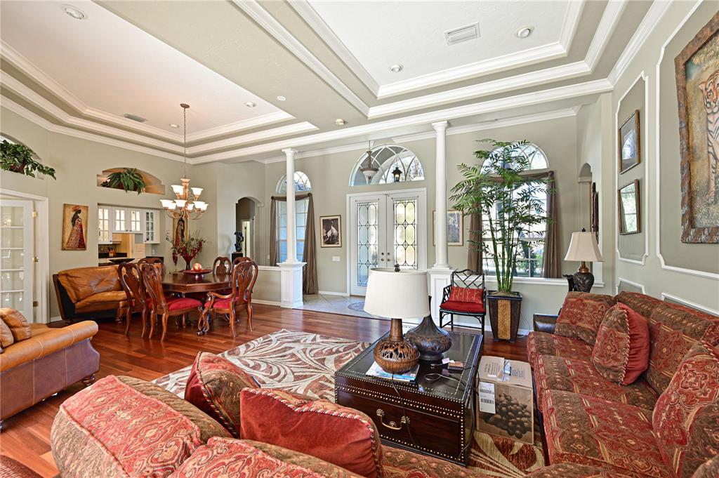 6602 Tallmast Circle Lakewood Ranch, FL 34202 - Photo 9 of 43 a living room with furniture and a large window