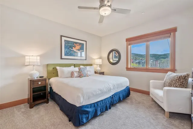 a bedroom with bed and a window