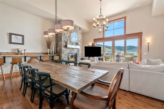 a view of a dining room with furniture wooden floor and chandelier