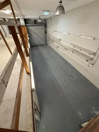 a room with wooden floor and furniture