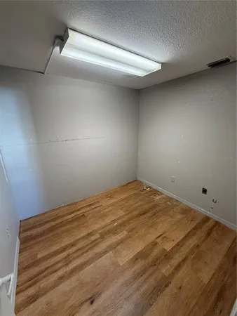 a view of a livingroom with furniture and staircase
