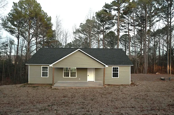 a front view of a house with yard