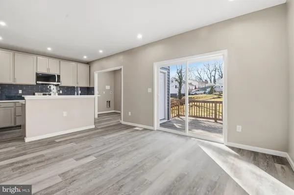 a view of kitchen with wooden floor