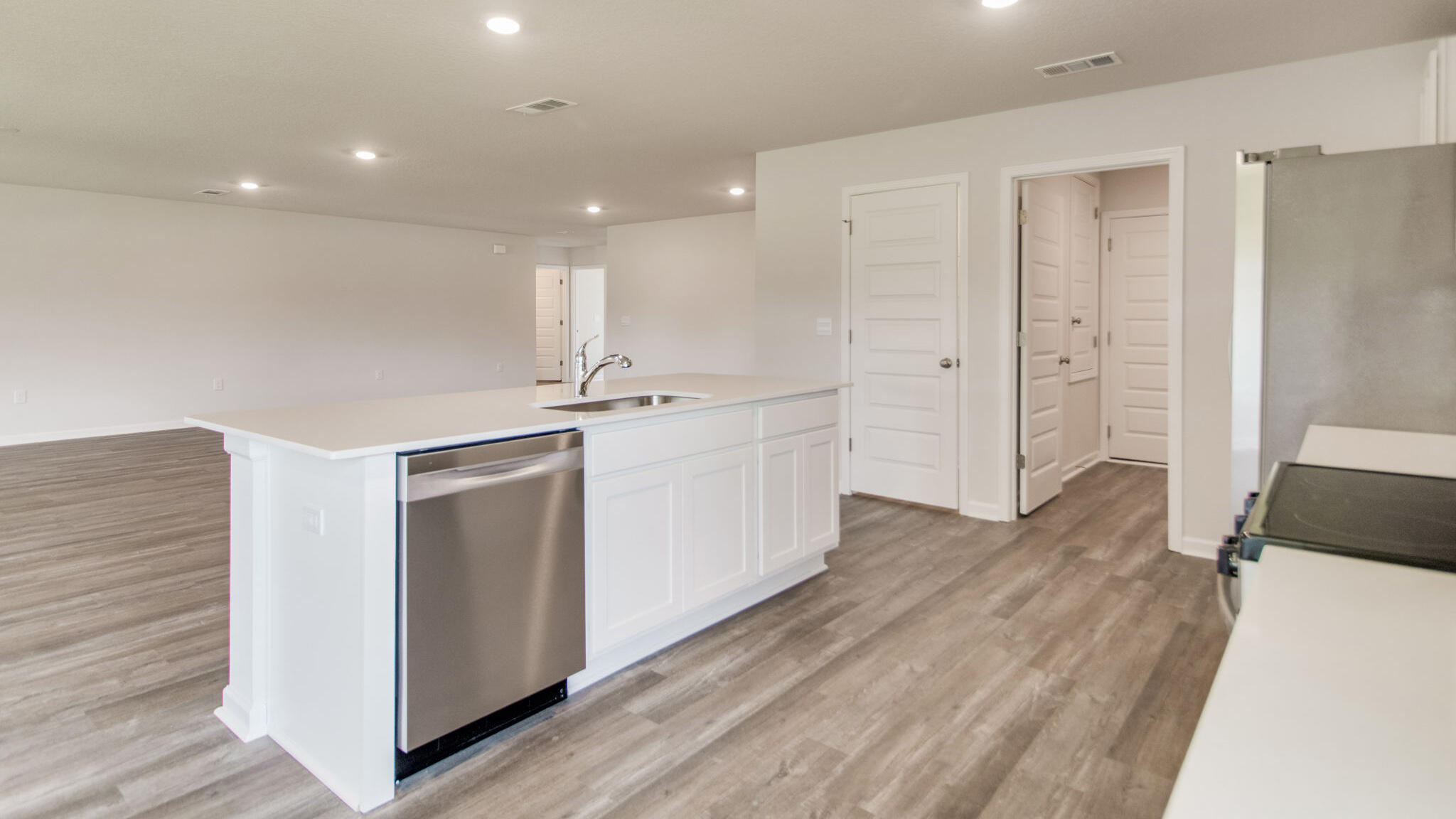 2512 Rutgers Road Crestview, FL 32536 - Photo 4 of 32 a kitchen with stainless steel appliances granite countertop a refrigerator and a stove top oven