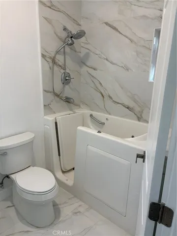 a bathroom with a sink and toilet