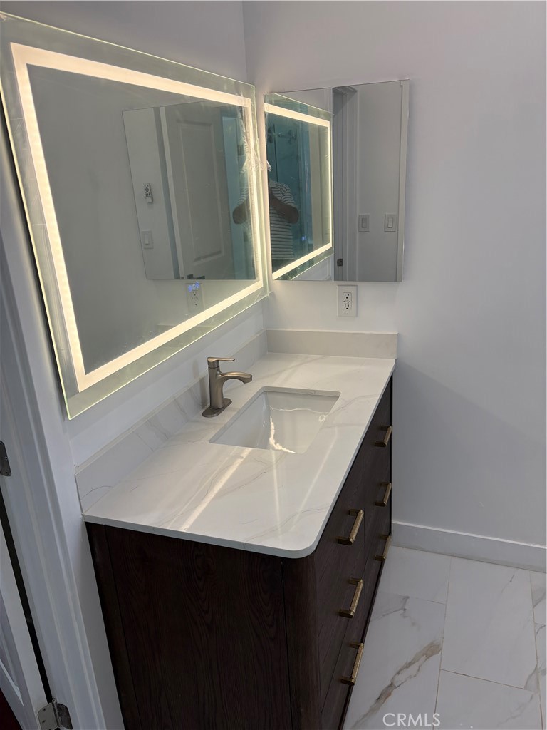 11862 Paseo Bonita Los Alamitos, CA 90720 - Photo 17 of 48 a bathroom with a sink and a mirror