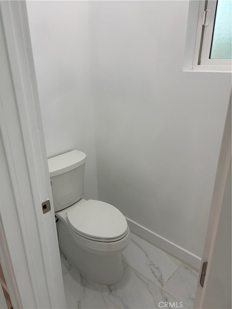 11862 Paseo Bonita Los Alamitos, CA 90720 - Photo 18 of 48 a white toilet sitting next to a shower