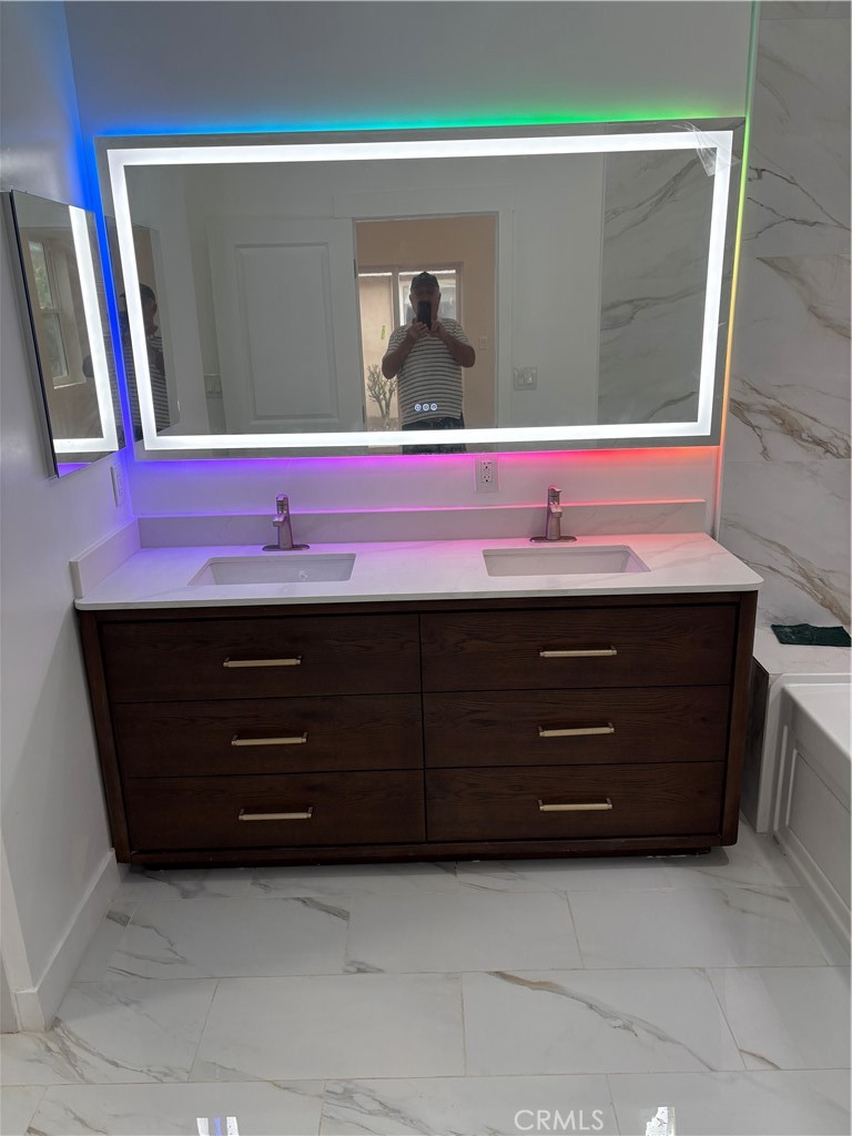 11862 Paseo Bonita Los Alamitos, CA 90720 - Photo 22 of 48 a bathroom with a sink and a mirror
