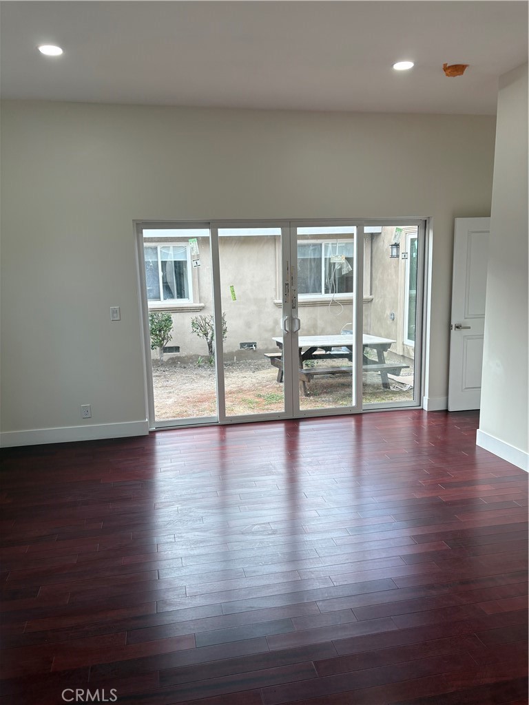 11862 Paseo Bonita Los Alamitos, CA 90720 - Photo 26 of 48 an empty room with wooden floor and windows