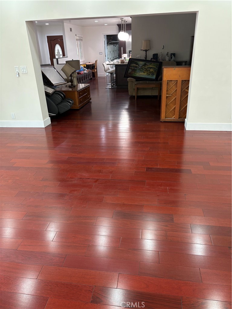 11862 Paseo Bonita Los Alamitos, CA 90720 - Photo 29 of 48 a living room with furniture and a wooden floor