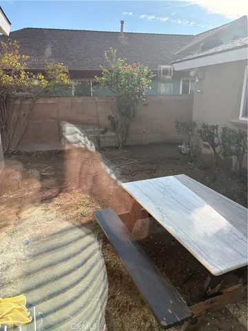 a view of a hallway with wooden floor and stairs