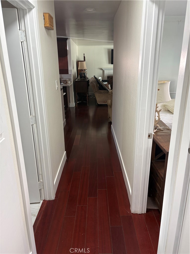 11862 Paseo Bonita Los Alamitos, CA 90720 - Photo 41 of 48 a view of a hallway with wooden floor and stairs
