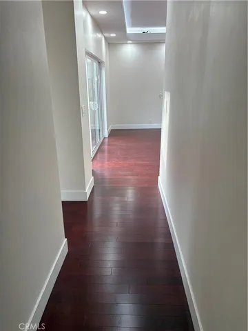 en empty room with wooden floor