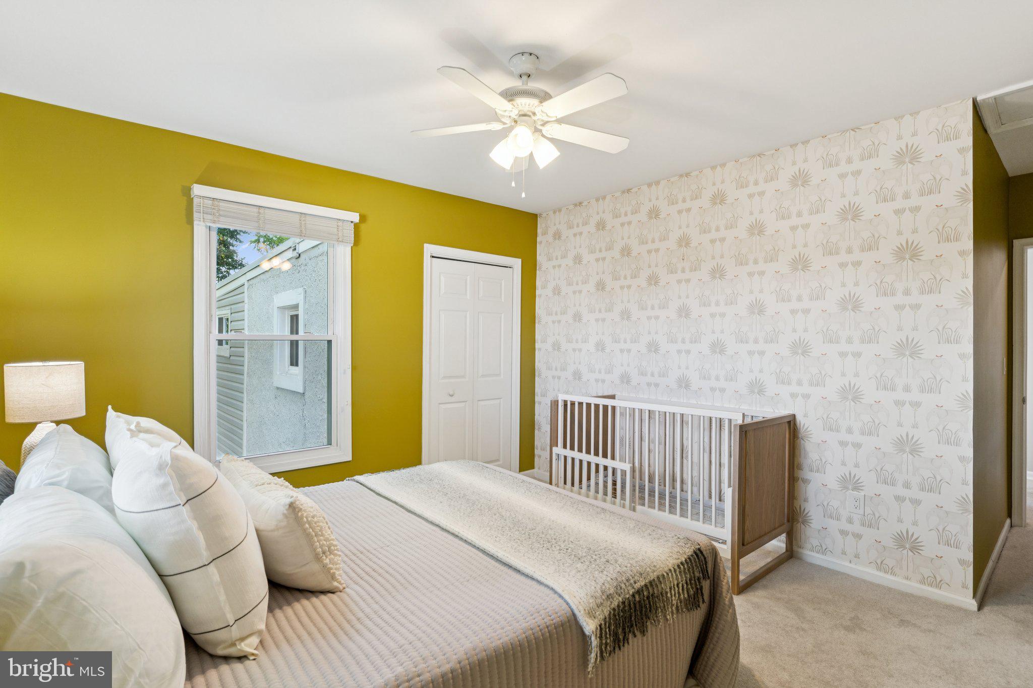 4001 Shepherd Street Brentwood, MD 20722 - Photo 24 of 39 a bedroom with a bed and a chandelier