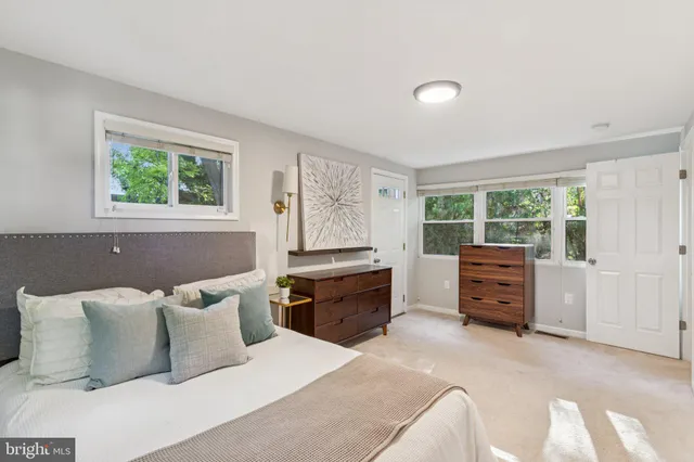 a bedroom with a bed and dresser