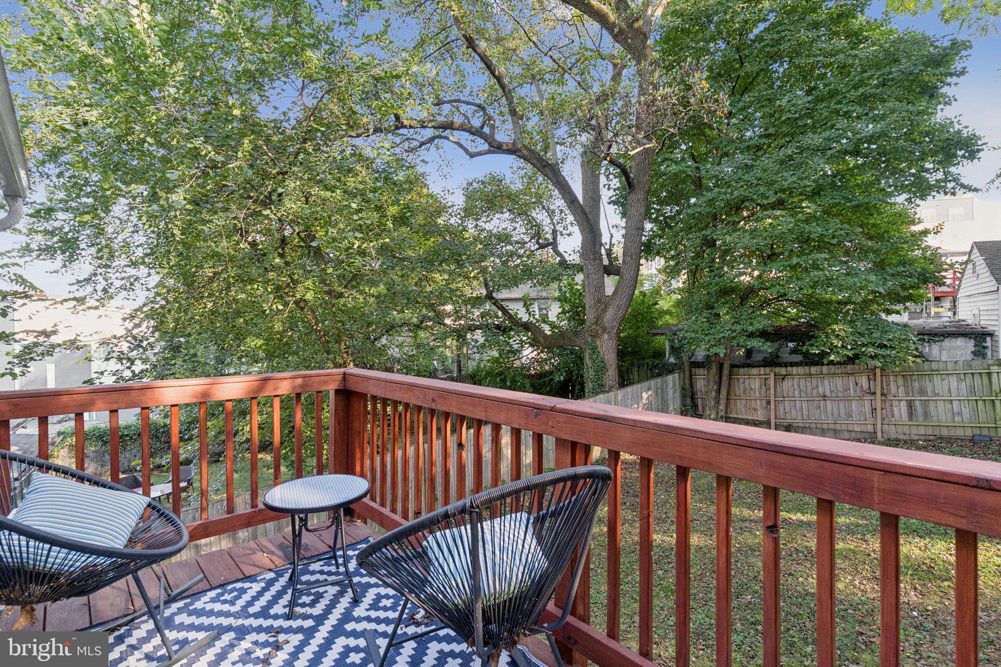 4001 Shepherd Street Brentwood, MD 20722 - Photo 32 of 39 a view of balcony with wooden floor and outdoor seating