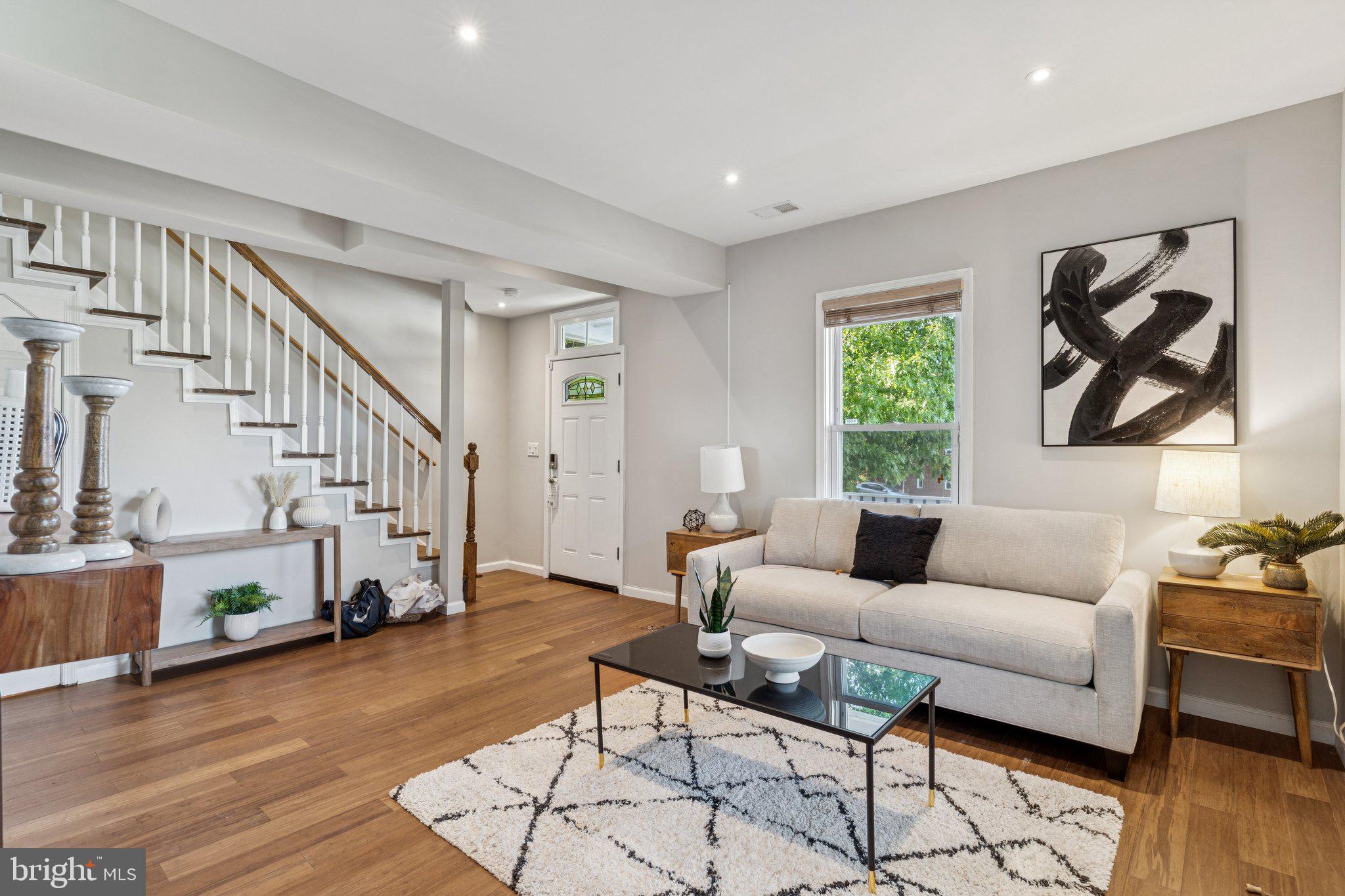 4001 Shepherd Street Brentwood, MD 20722 - Photo 5 of 39 a living room with fireplace furniture and a wooden floor